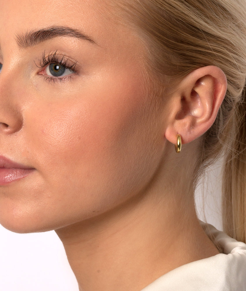 Tykke hoops øreringe til kvinder i guld