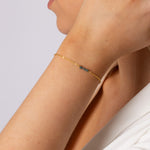Elegant armbånd til kvinder i guld med blå rådiamanter